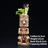 Intriguing tiki-inspired ceramic cocktail mug with straw and mint garnish, unique barware idea.