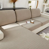 Textured beige sectional sofa in modern living room, inviting cozy relaxation and style