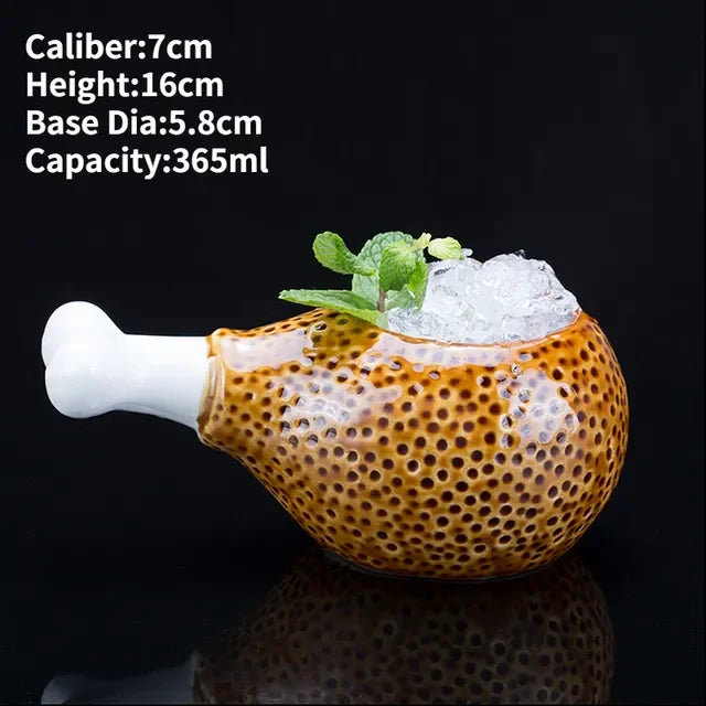 Curious ceramic mug shaped like a chicken drumstick, filled with ice and mint, unique home décor
