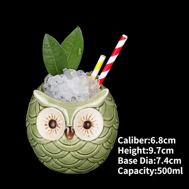 Charming owl-shaped ceramic cup with ice, leaves, and striped straws, perfect for unique décor.